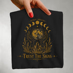 Trust The Signs Moon Phase Tee — Celestial Spiritual Graphic Shirt